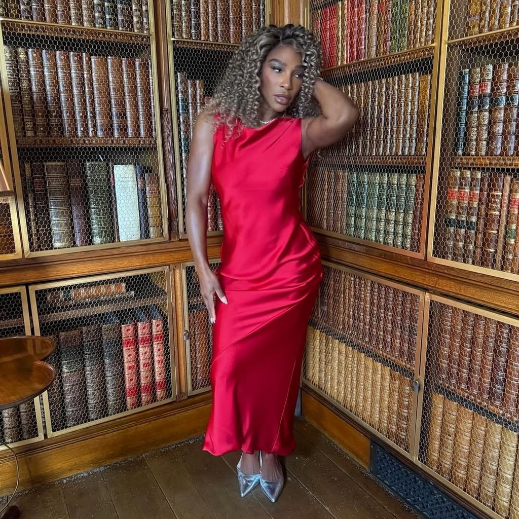 Serena Williams posing in a red dress