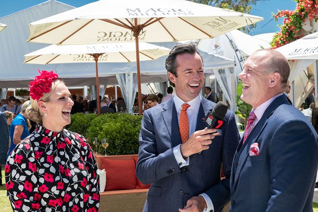 Mike and Zara Tindall laugh while interviewed at Magic Millions 2019