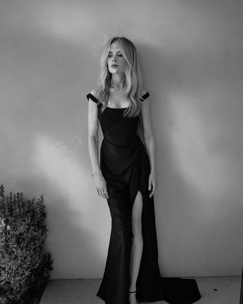 Nicole in a black Vivienne Westwood dress