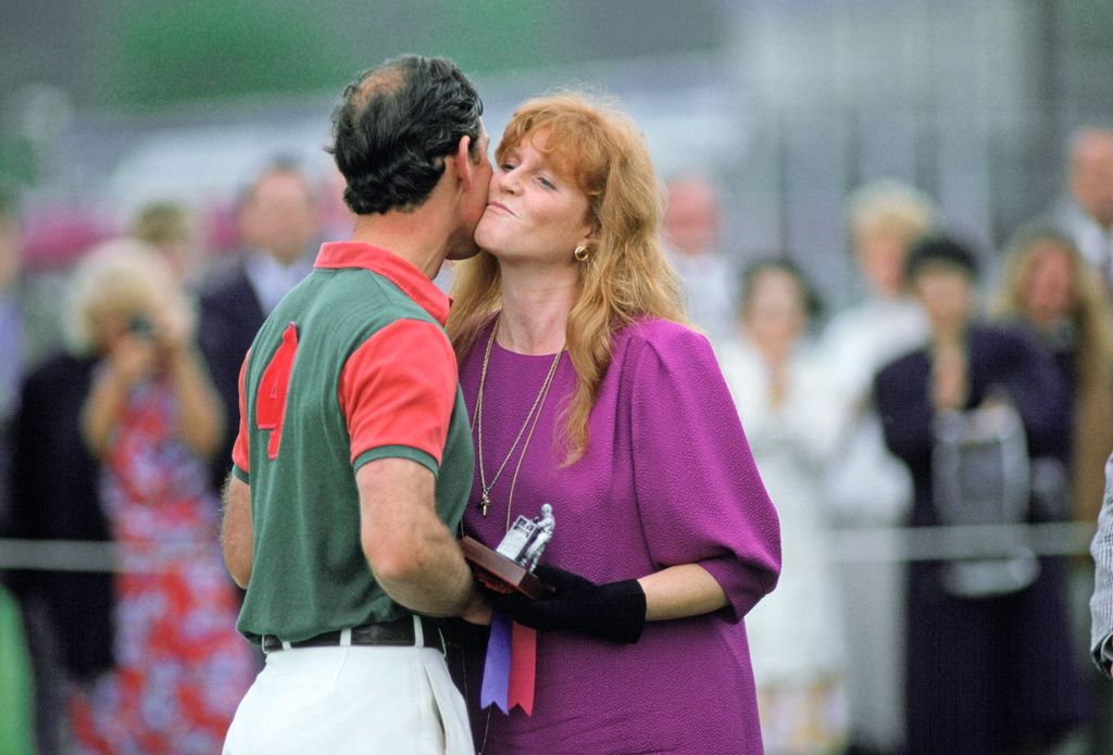 A photo of Sarah Ferguson and Prince Charles kissing on the cheek