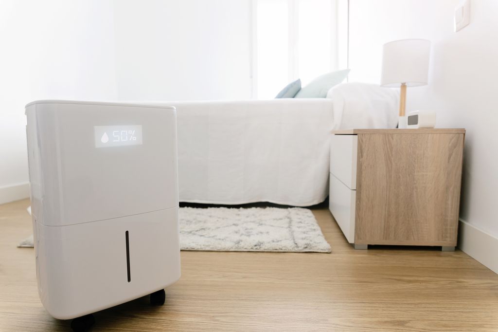 Dehumidifier in white bedroom