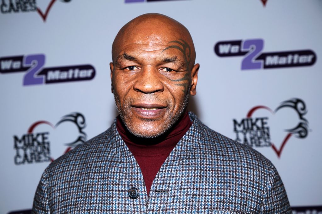 mike tyson grey suit red carpet