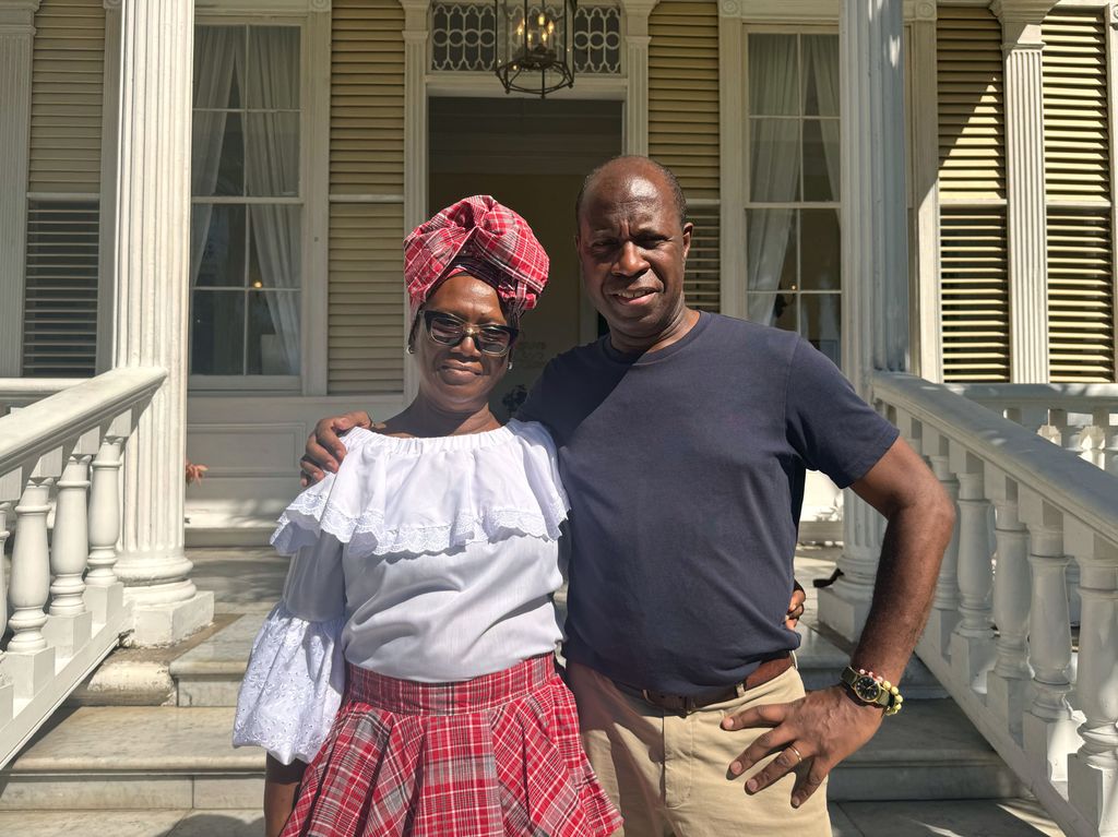Clive Myrie and Barbara Beckford outside the beautiful Devon House in Kingston