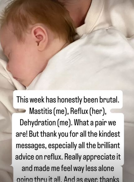 A baby girl lying on her mother