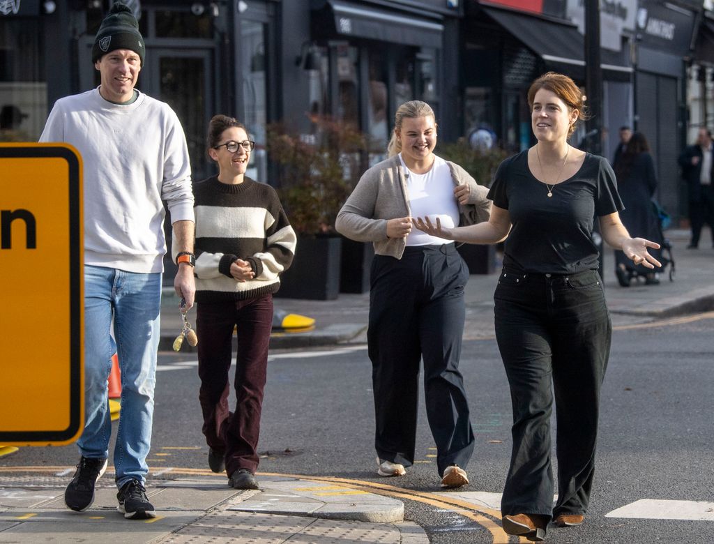Princess Eugenie and Jack Brooksbank laughing with a group of friends