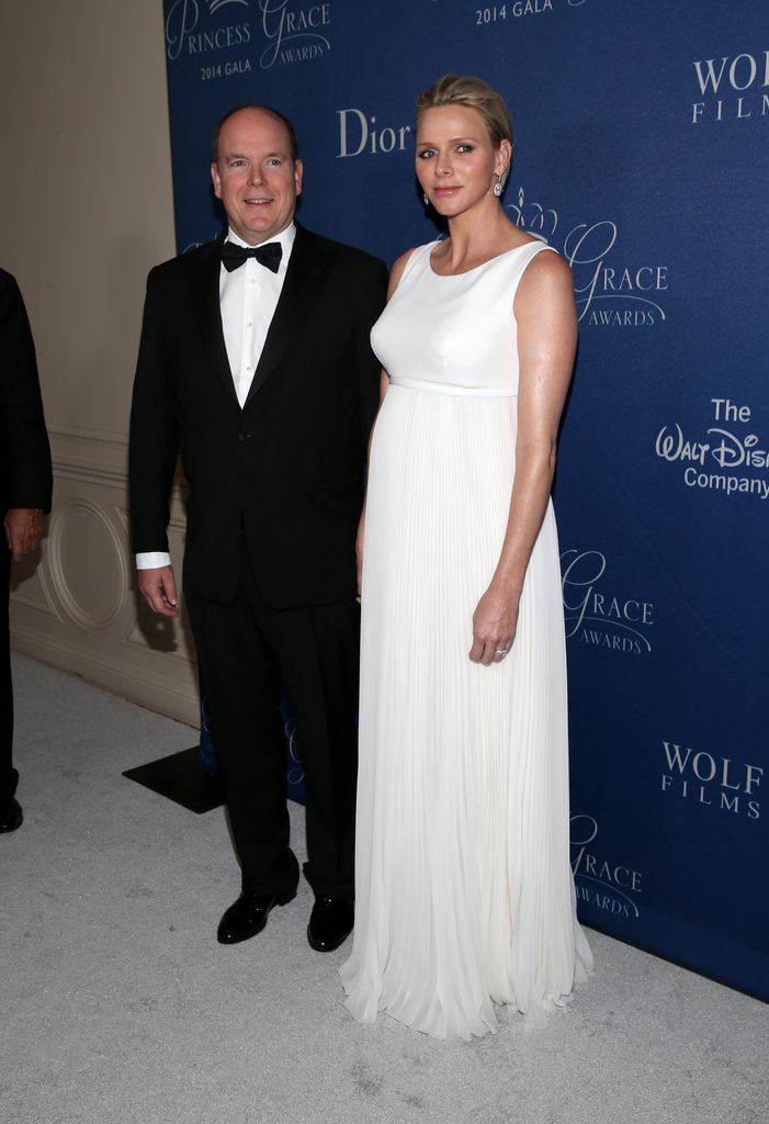 Princess Charlene in a white gown with Prince Albert