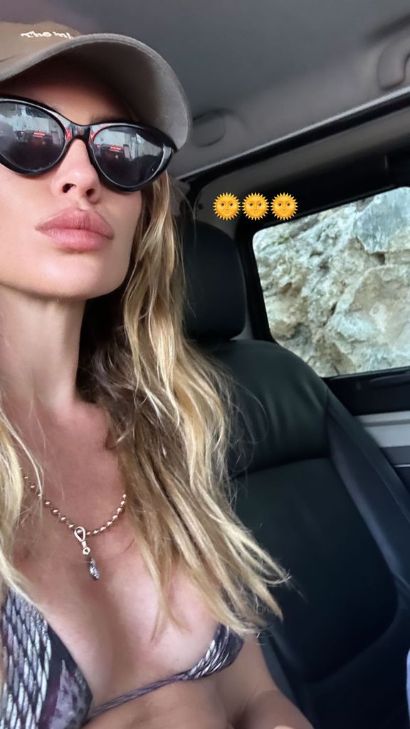 Abbey Clancy wearing bikini in a car