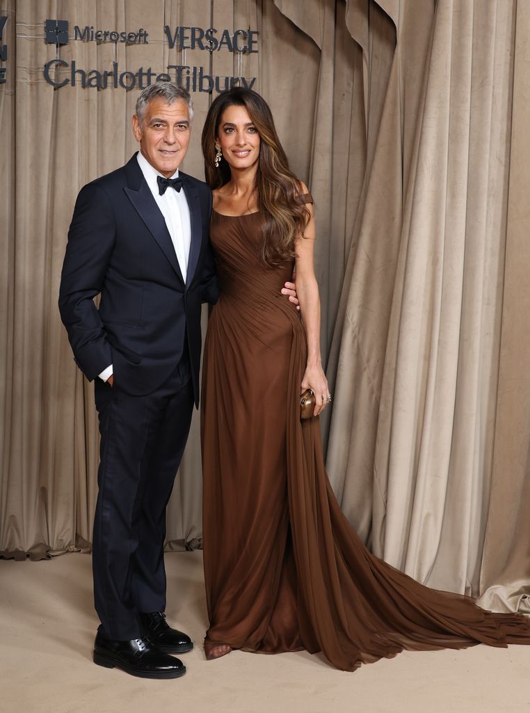 George Clooney and Amal Clooney attend the Clooney Foundation For Justice's The Albies at The Natural History Museum on October 03, 2025 in London, England