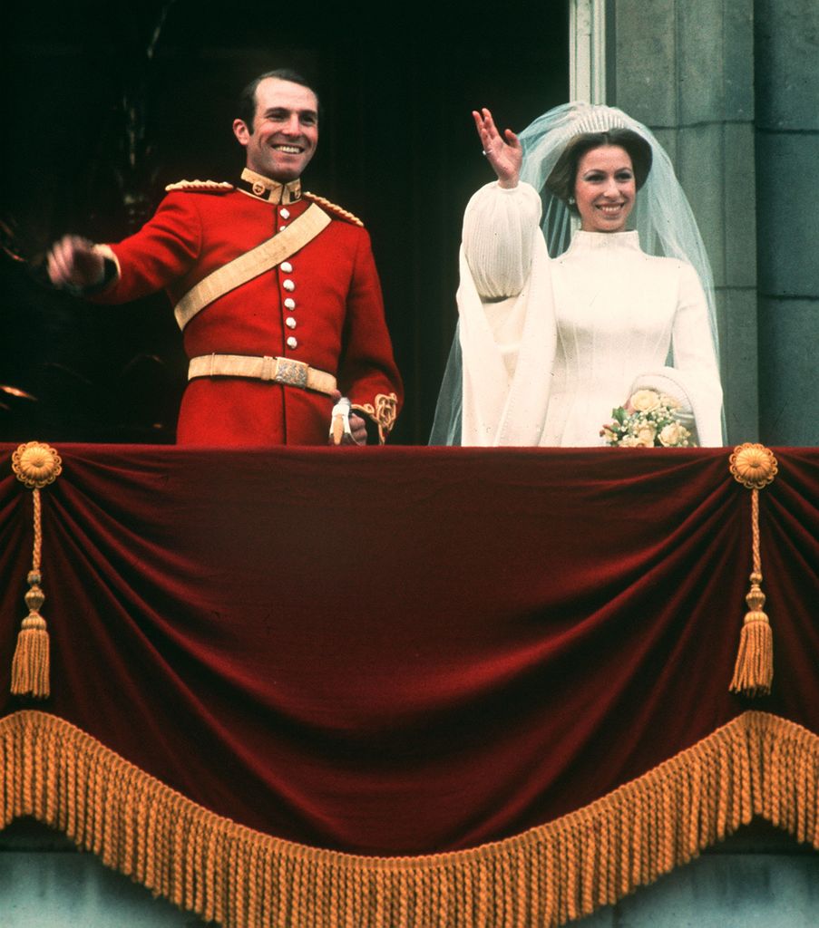 Princess Anne and Captain Mark Phillips waving on the balcony of Buckingham Palace on their wedding day.   