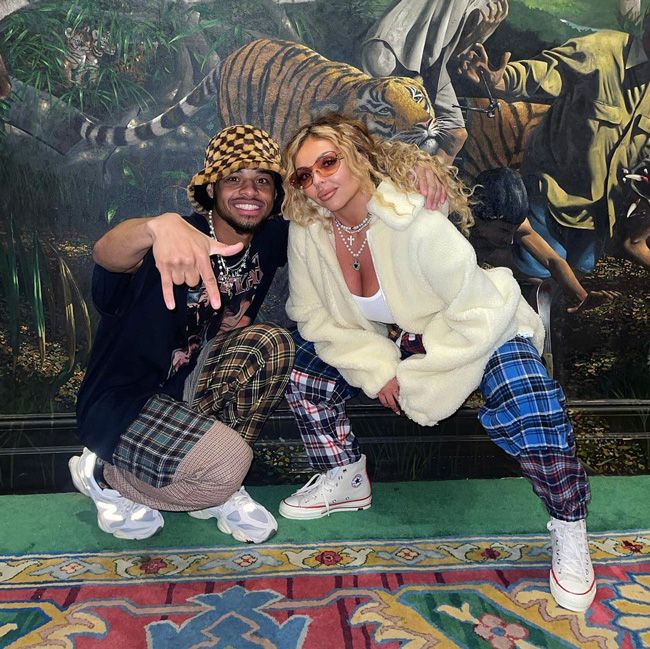 jesy and zion pose in matching baggy check print trousers