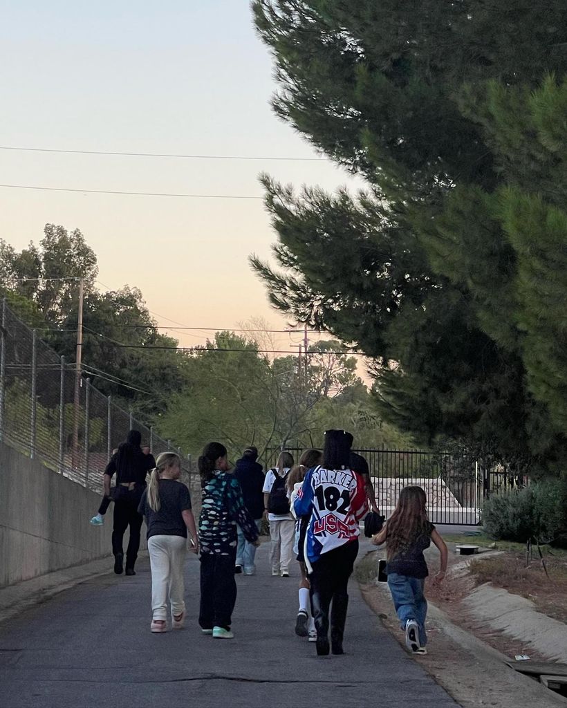 Kourtney Kardashian with children outside