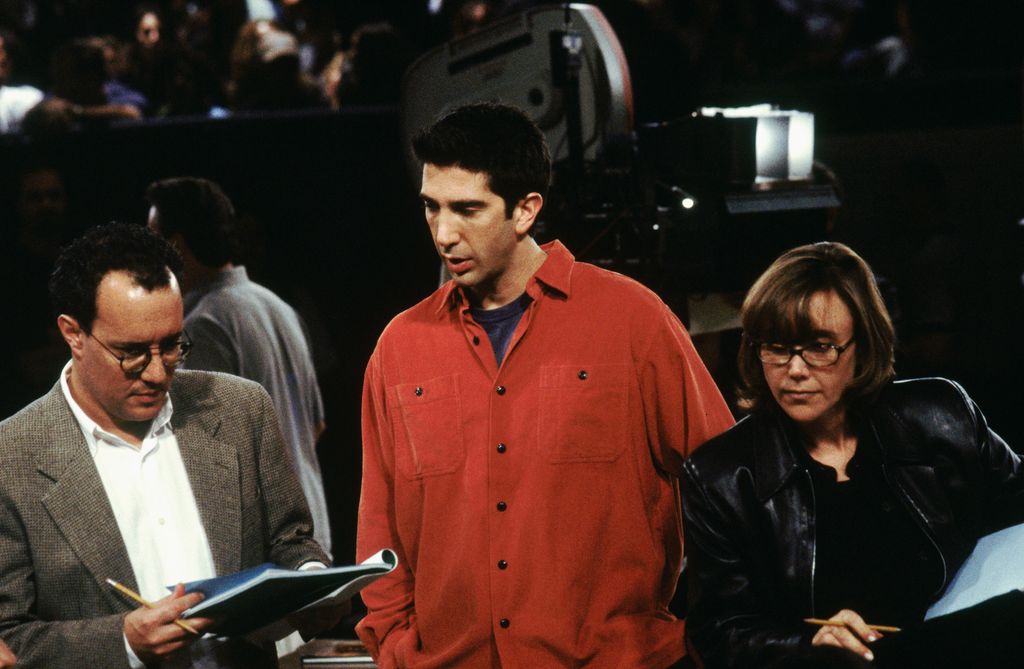 FRIENDS -- "The One on the Last Night" Episode 6 -- Pictured: (l-r) Exectuive producer David Crane, actor David Schwimmer directing an episode of "Friends", executive producer Marta Kauffman