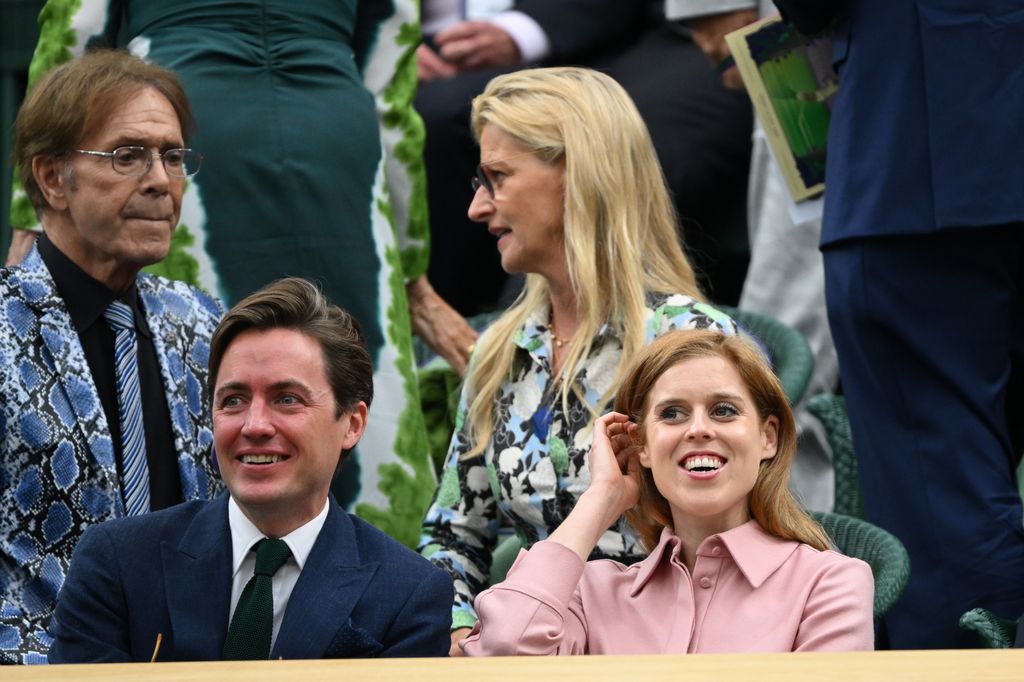 Princess Beatrice and Edoardo Mapelli Mozzi giggling together at Wimbledon