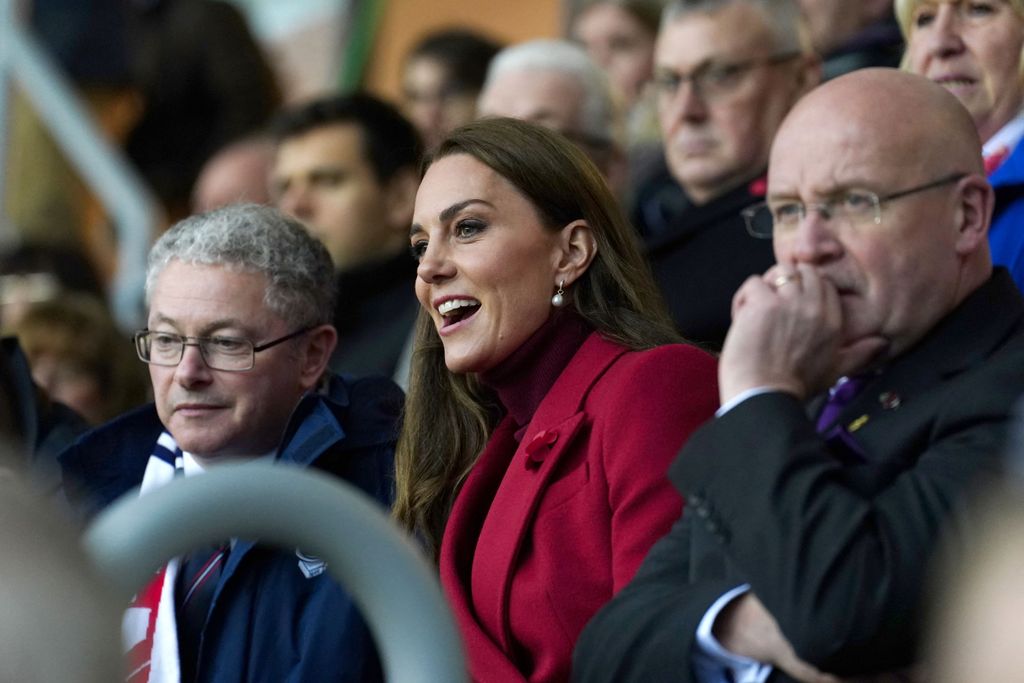 Princess Kate in red watching rugby