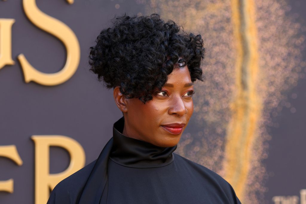 Tanya Moodie looking into the distance in a black top