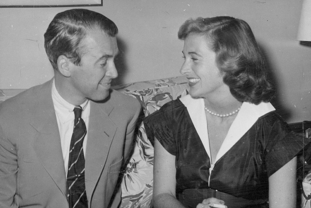 photo of jimmy stewart and gloria mclean smiling at each other