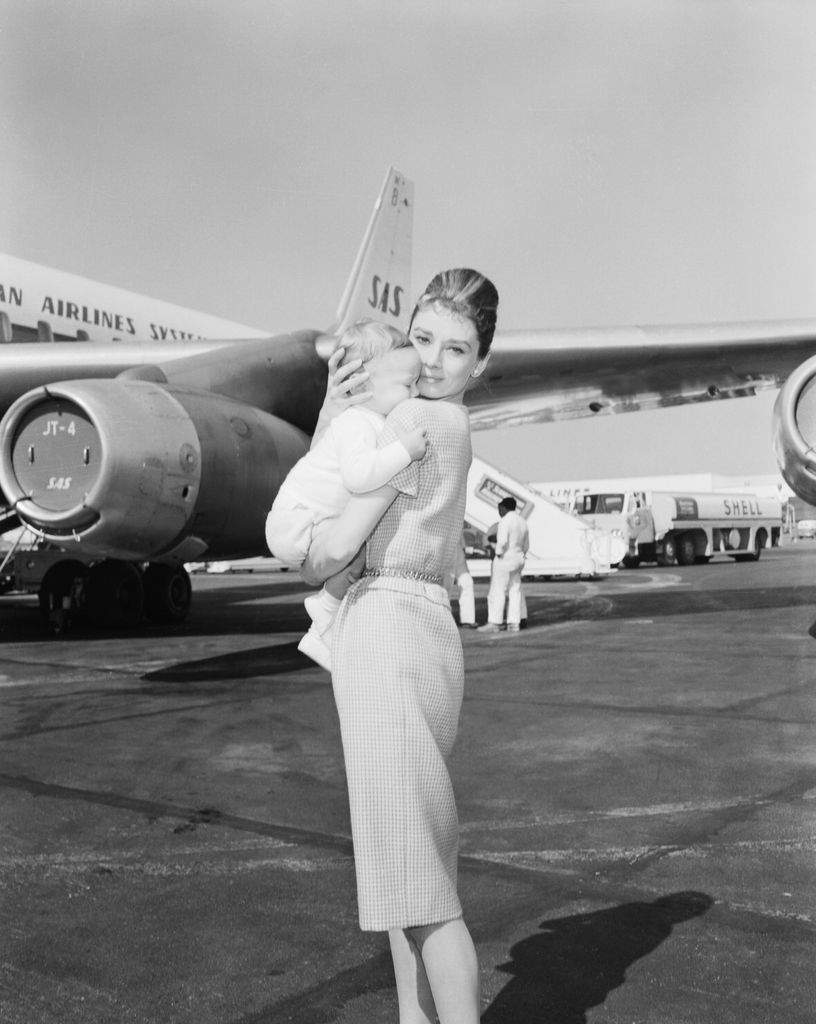 (Original Caption) Actress Audrey Hepburn and son Sean, 7 months, leave for Rome via jetliner. She eventually was to join husband Mel Ferrer in Yugoslavia.