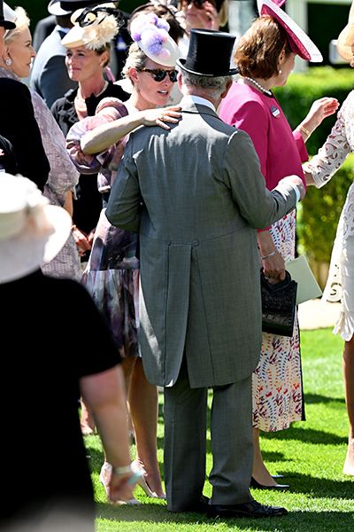 zara tindall greets prince charles at royal ascot