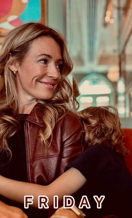 Cat Deeley with young son hugging 