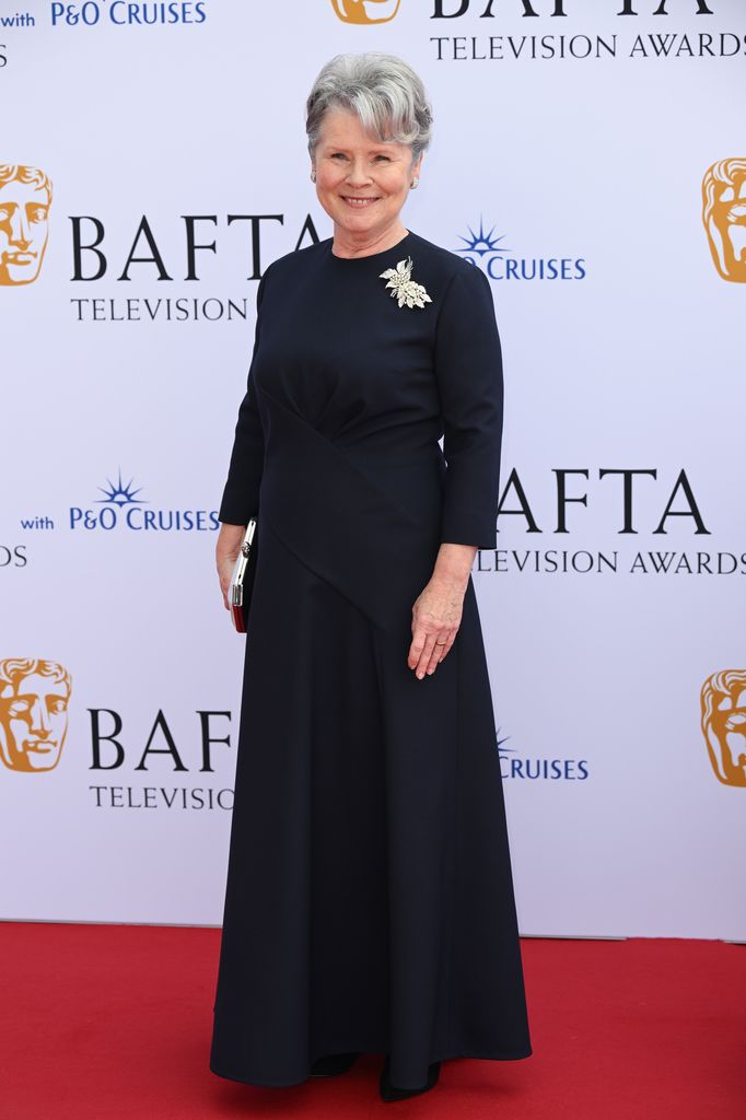 Imelda Staunton smiling on the BAFTA red carpet
