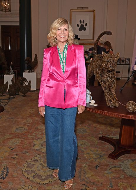 Glynis Barber in jeans and a pink jacket