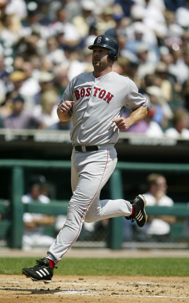 Dave McCarty #10 of the Boston Red Sox scores as he crosses home plate against the Detroit Tigers on August 8, 2004 at Comerica Park in Detroit, Michigan.  The Red Sox defeated the Tigers 11-9.  (Photo by Tom Pidgeon/Getty Images)