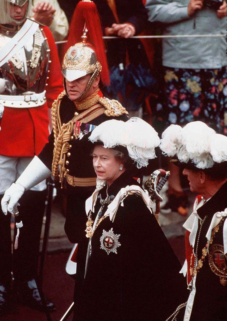 Andrew Parker Bowles in regimental uniform alongside Queen Elizabeth II