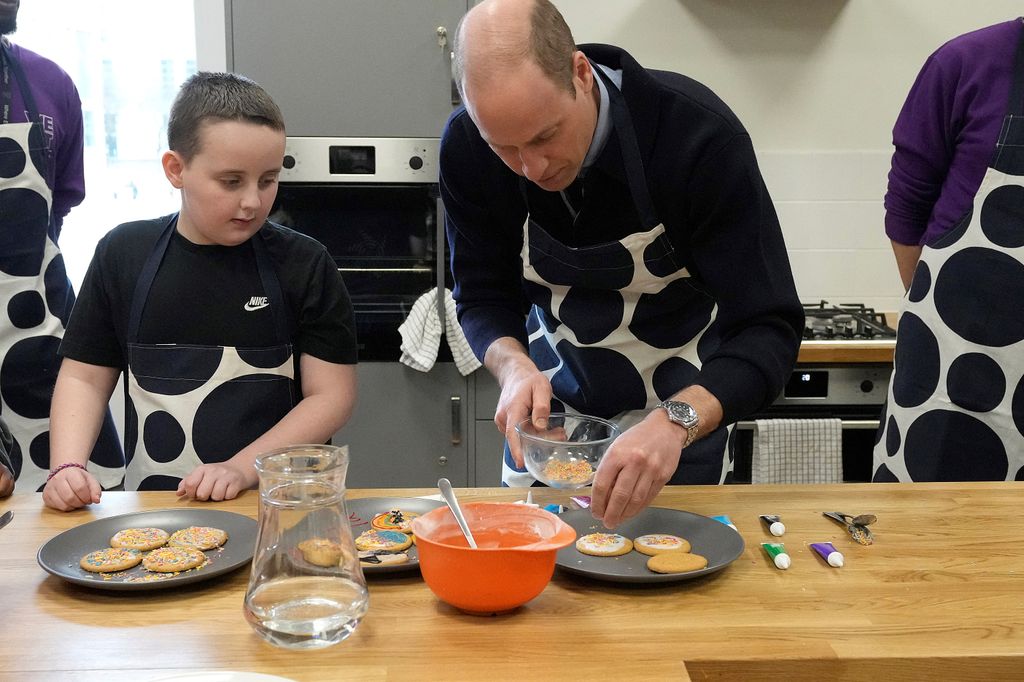 Prince William decorates biscuits