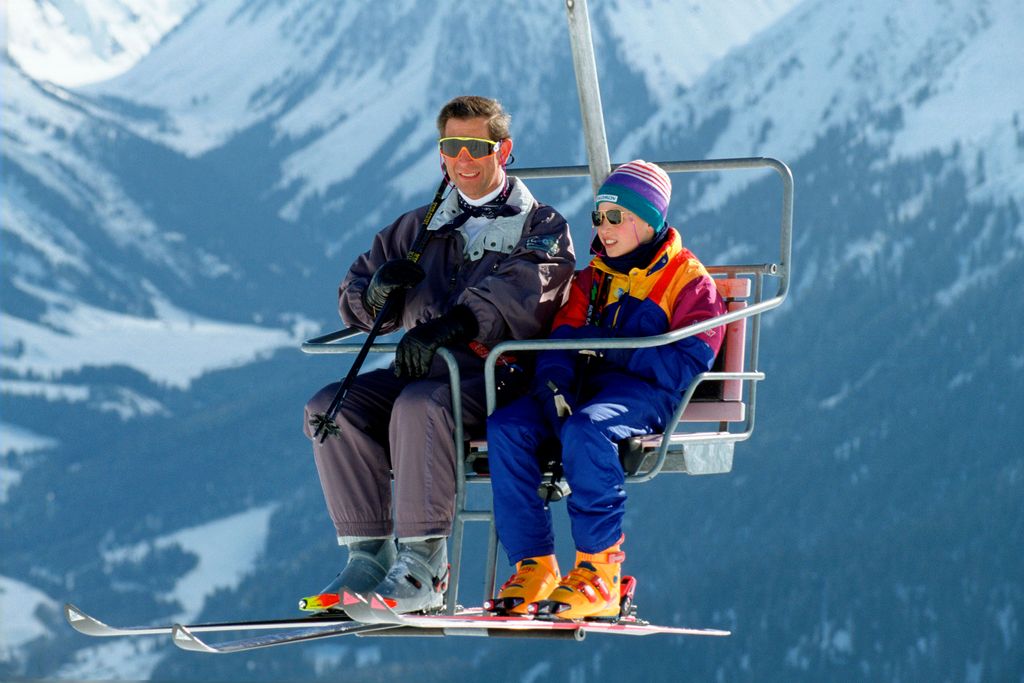 King Charles in ski suit sitting in ski life with Prince William in Klosters Switzerland