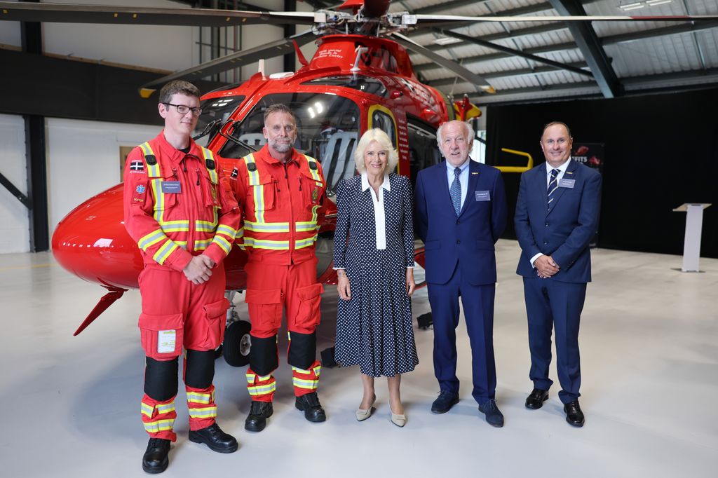 Queen Camilla standing in front of air ambulance in Cornwall