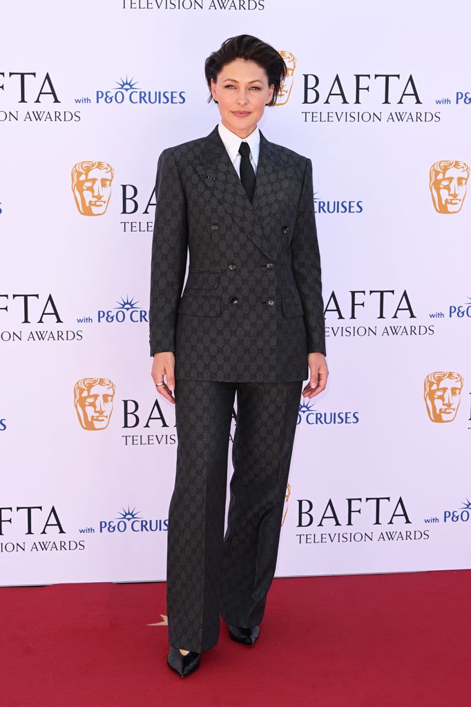 Emma Willis in a plaid suit on the red carpet