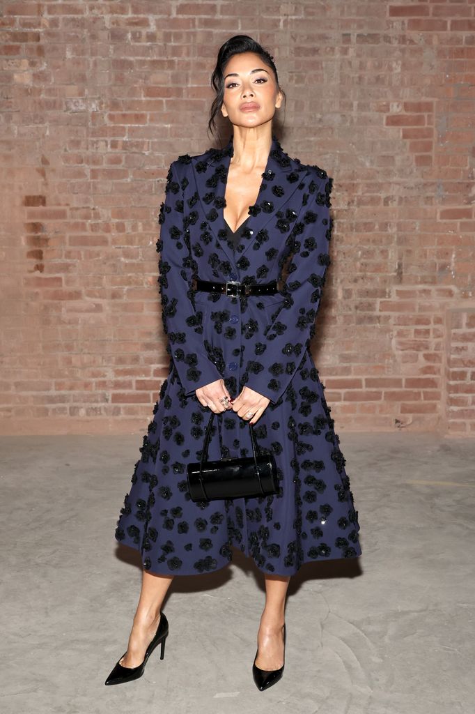 Nicole Scherzinger in purple and black floral coat dress