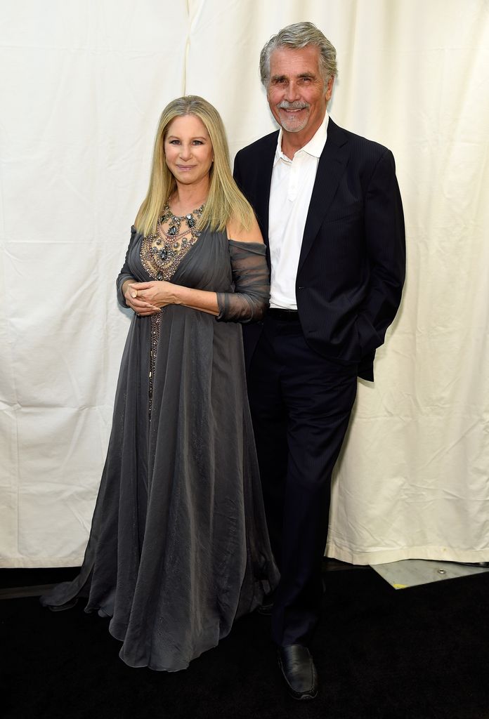 Barbra Streisand (L) and James Brolin pose backstage during the tour opener for "Barbra - The Music... The Mem'ries... The Magic!" at Staples Center on August 2, 2016 in Los Angeles, California.
