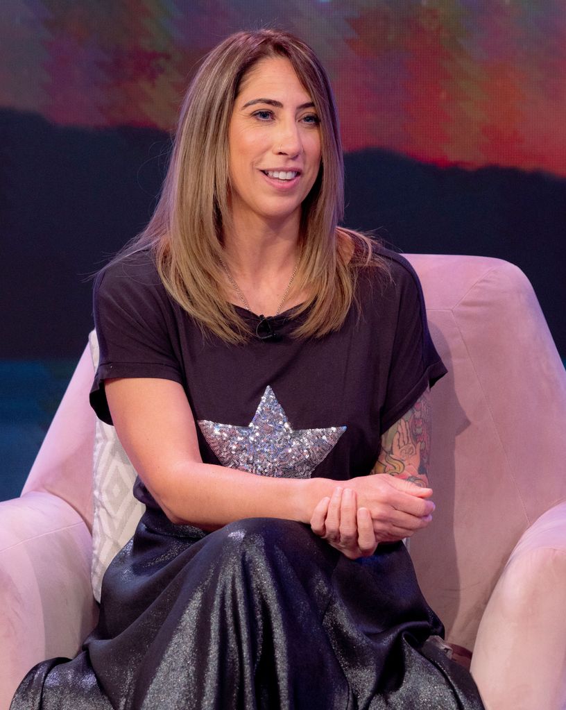 Woman in a black star print top