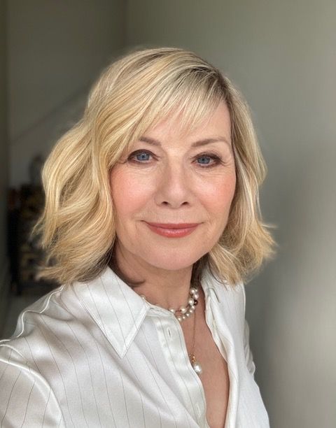 Woman in a white shirt taking a selfie