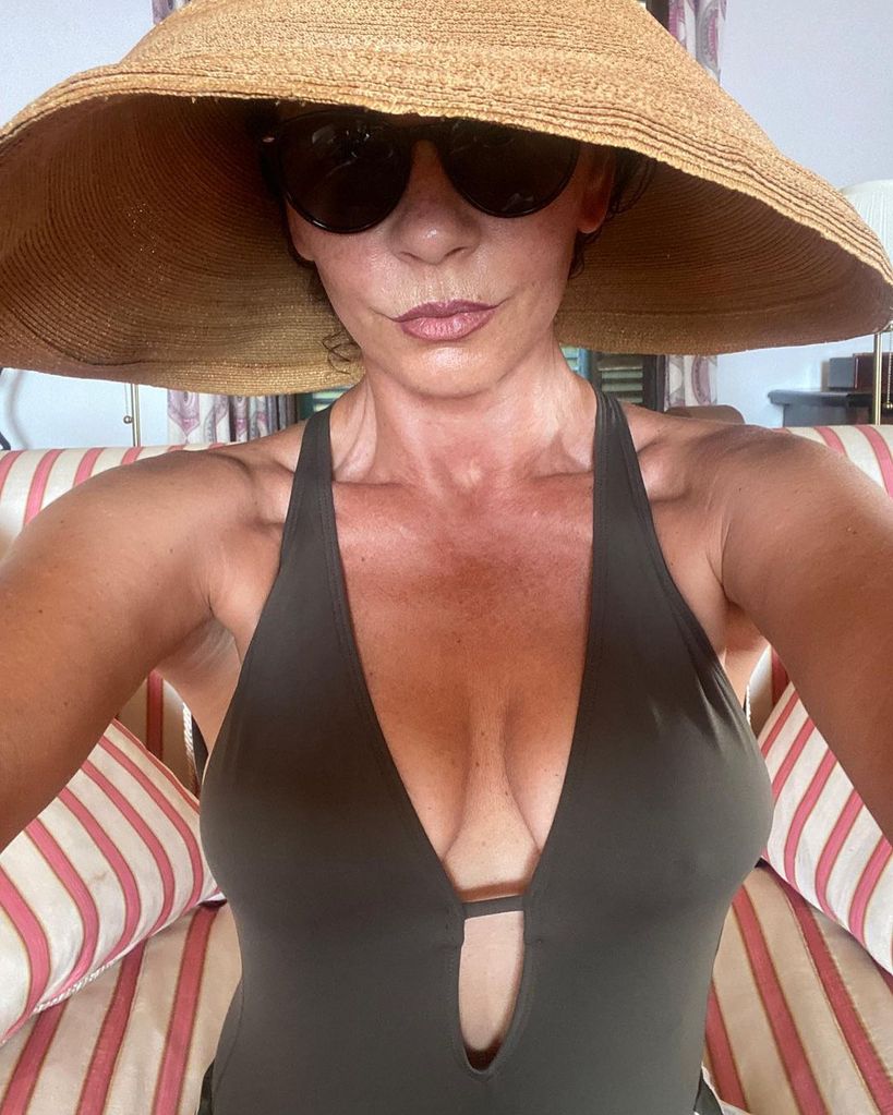 Catherine Zeta Jones in a swimsuit and sunhat