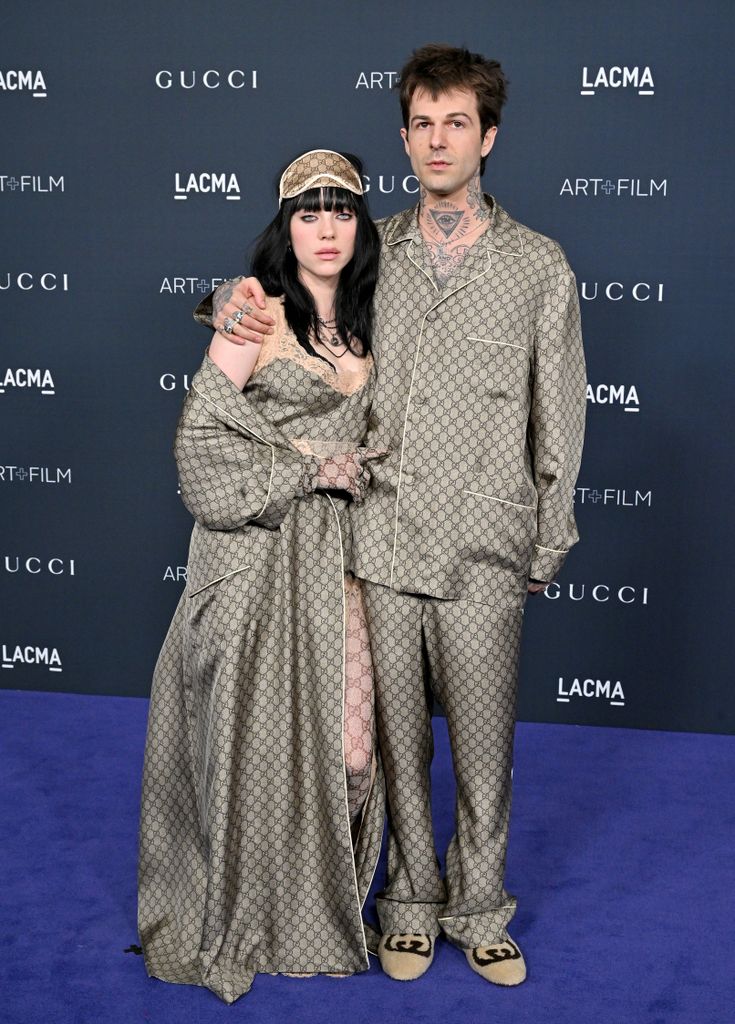 Jesse and Billie wearing Gucci outfits on the blue carpet