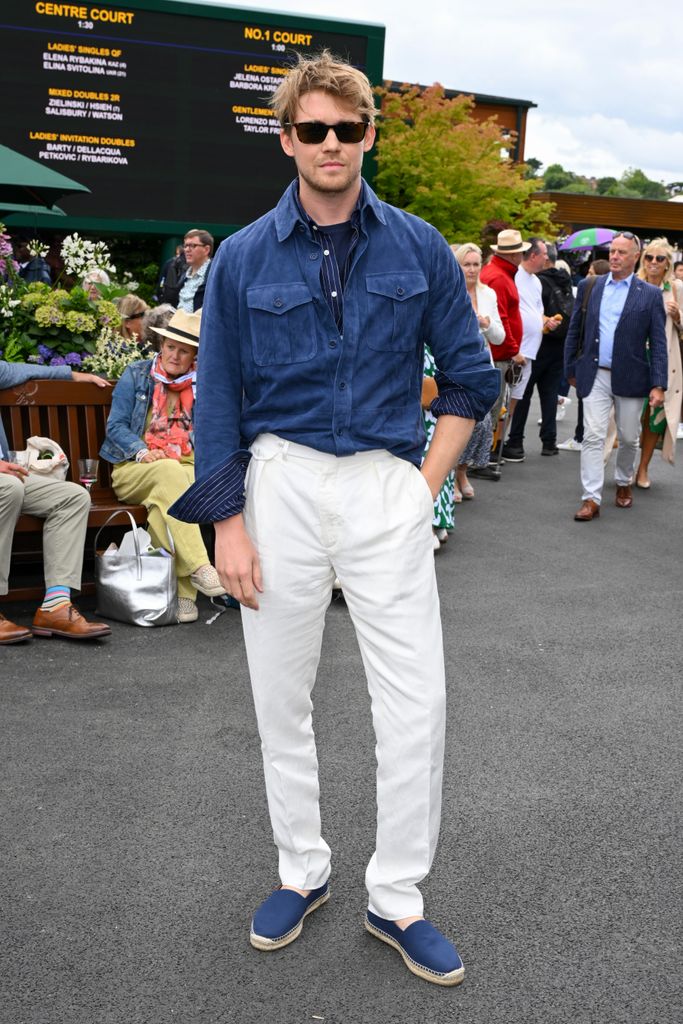 Joe Alwyn blue jacket and white chinos