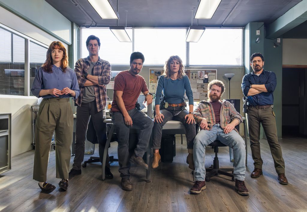 group of people sitting in police office
