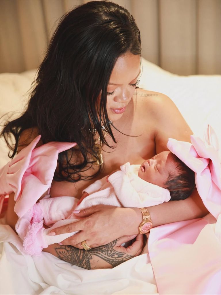 Rihanna hold her newborn daughter Rocki