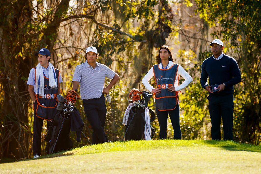 Tiger Woods, his daughter Sam Woods, son Charlie Woods and family friend Luke Wise look on while playing the 13th hole during the first round of the PNC Championship at Ritz-Carlton Golf Club on December 21, 2024 in Orlando, Florida