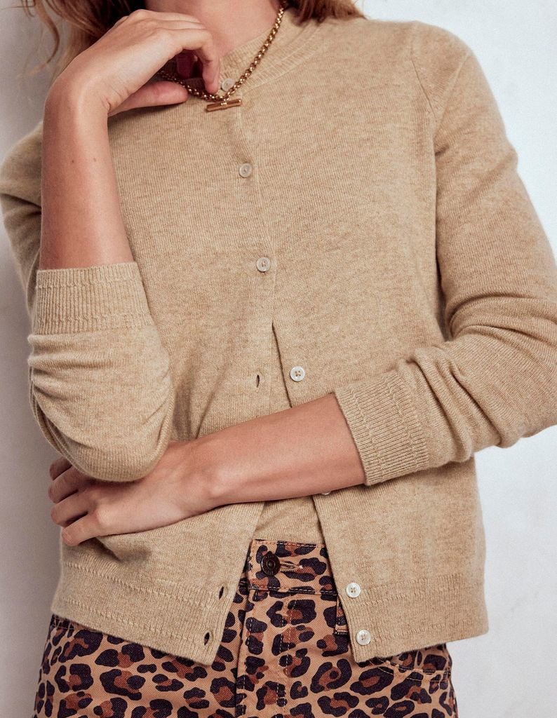model in beige cardigan