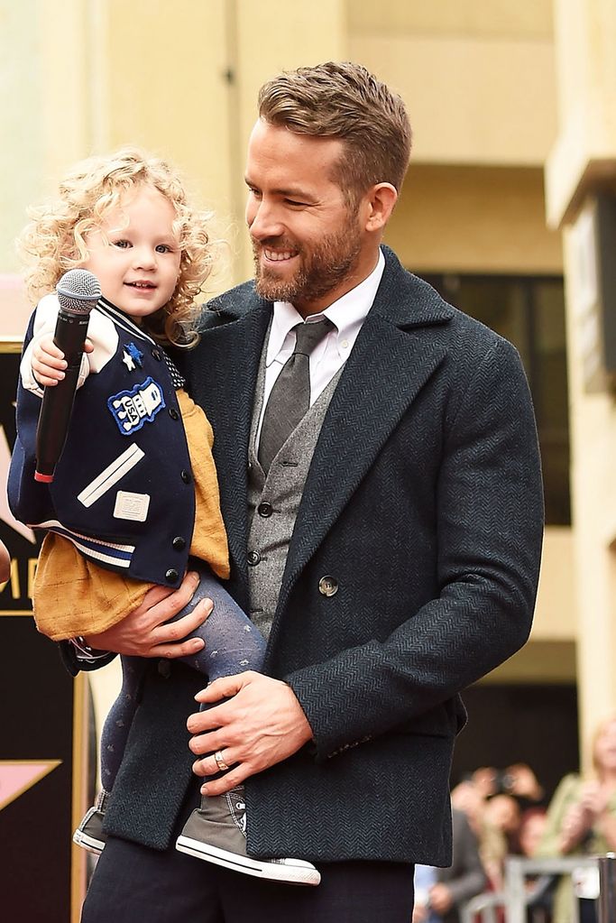 Actor Ryan Reynolds (R) poses for a photo with his daughter, James Reynolds during a ceremony honoring him with a star on the Hollywood Walk of Fame on December 15, 2016 in Hollywood, California.