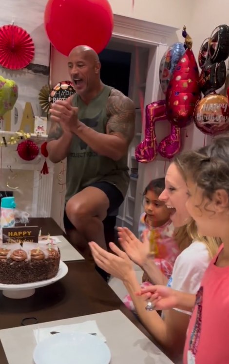 Dwayne Johnson with his two daughters celebrating their mom's birthday