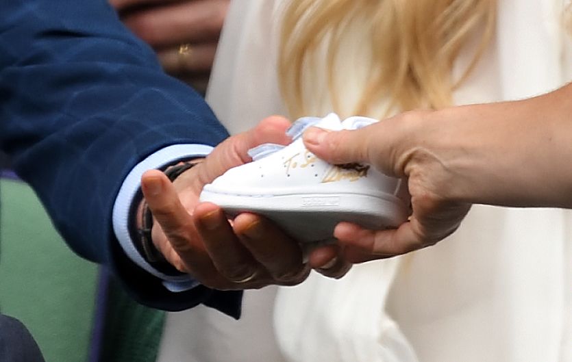 Stan Smith handing the cute strainer to Princess Kate