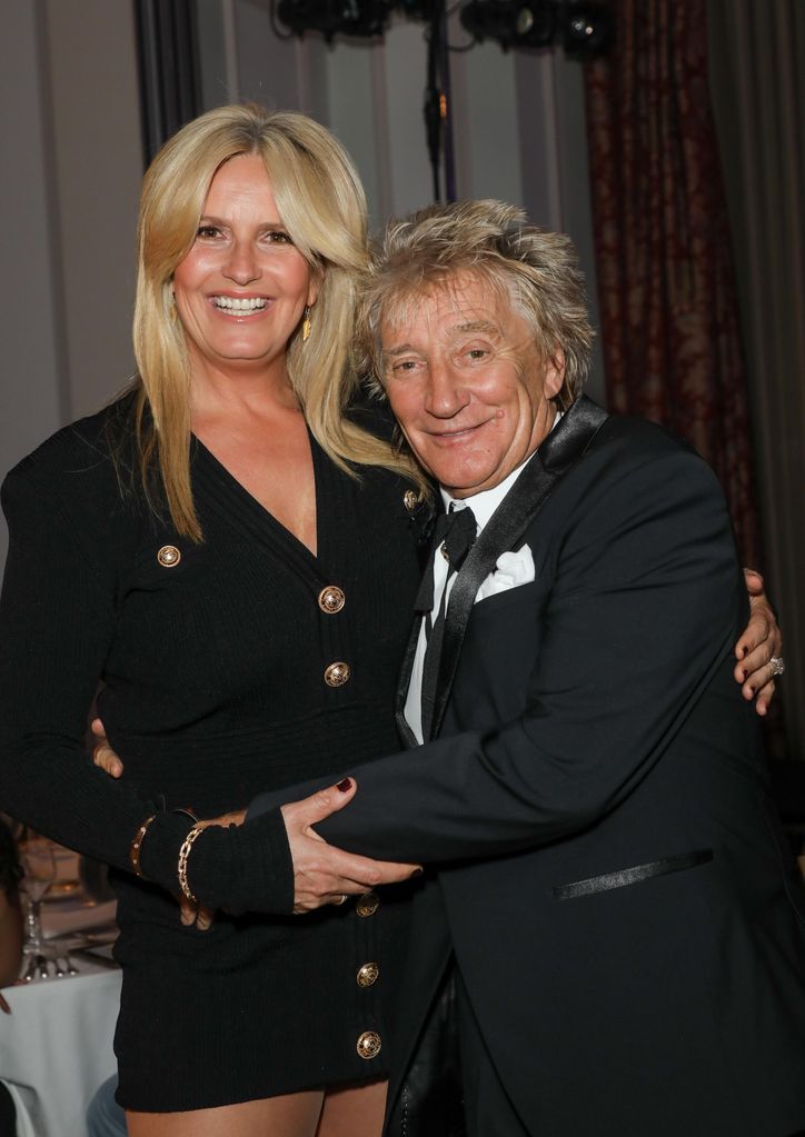 Penny Lancaster and Rod Stewart in black