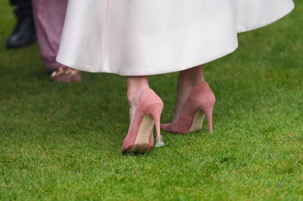  A close-up of Zara Tindall's footwear with heel stoppers at the Sovereign's Garden Party at Buckingham Palace on May 21, 2024 in London, England.