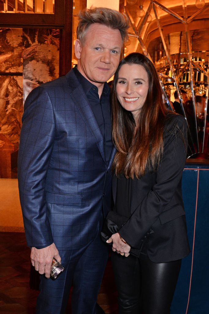 gordon ramsay in blue suit with wife tana smiling 