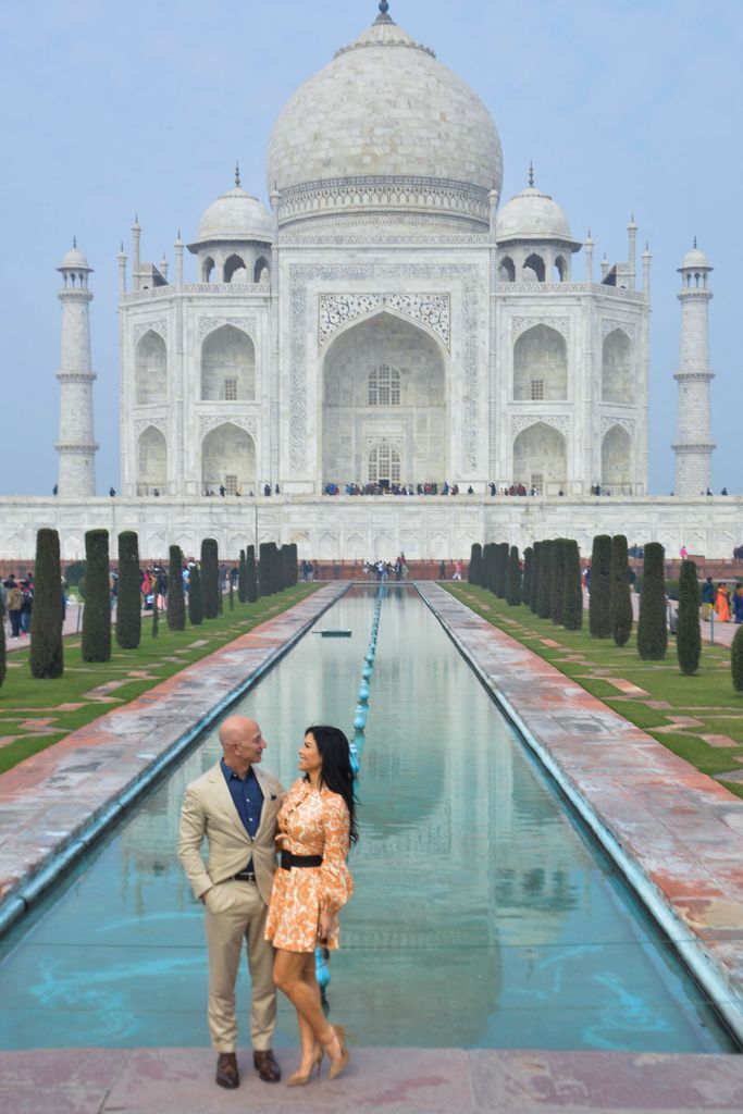 Jeff Bezos and his girlfriend Lauren Sanchez pose for a picture during their visit at the Taj Mahal in Agra on January 21, 2020