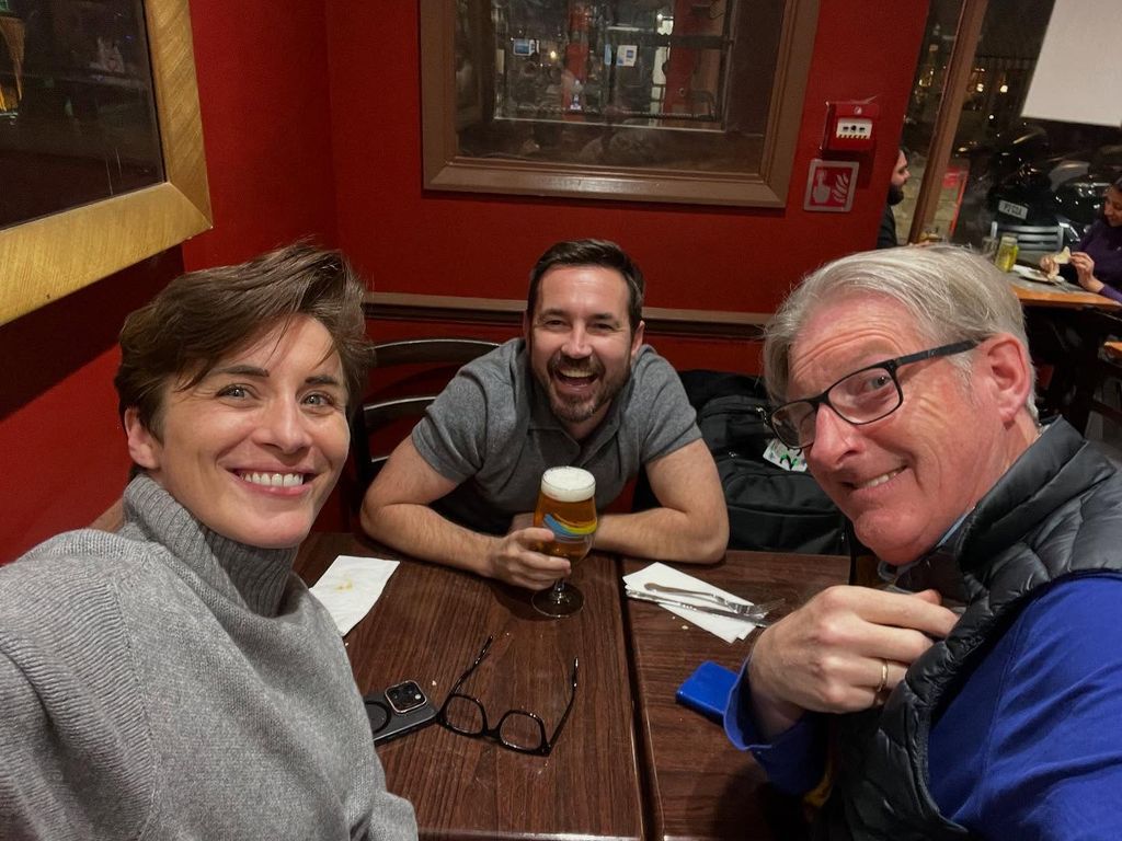 three actors enjoying reunion 